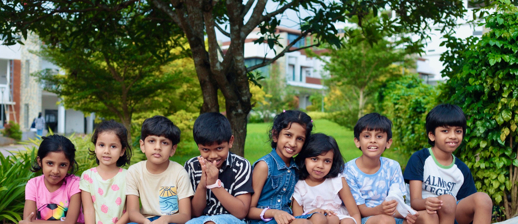 Little Lambs Sunday School children sitting together outdoors